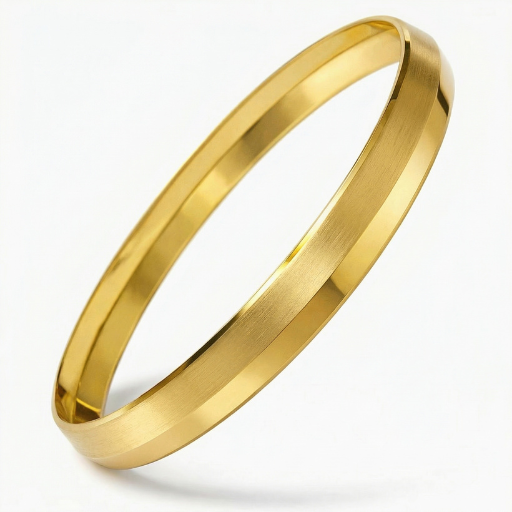 1.Define your look with a masterclass in geometric minimalism. This sleek gold-toned bangle features a striking knife-edge silhouette that transforms a classic accessory into a modern architectural statement.