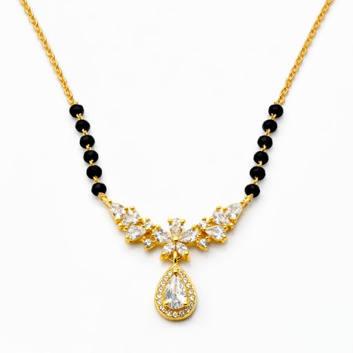 Embrace the radiance of a blooming garden with this gold-toned Mangalsutra. Featuring a graceful wing-like arrangement of marquise crystals and a stunning halo drop, it is a sophisticated tribute to tradition with a high-fashion, floral aesthetic.