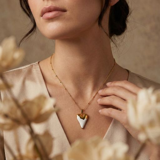 Embrace the peak of contemporary sculptural jewelry with this masterfully crafted pendant. Featuring a masterclass in organic form and bold material contrast, this piece offers a sophisticated "dipped" silhouette that serves as the ultimate expression of modern, minimalist luxury.